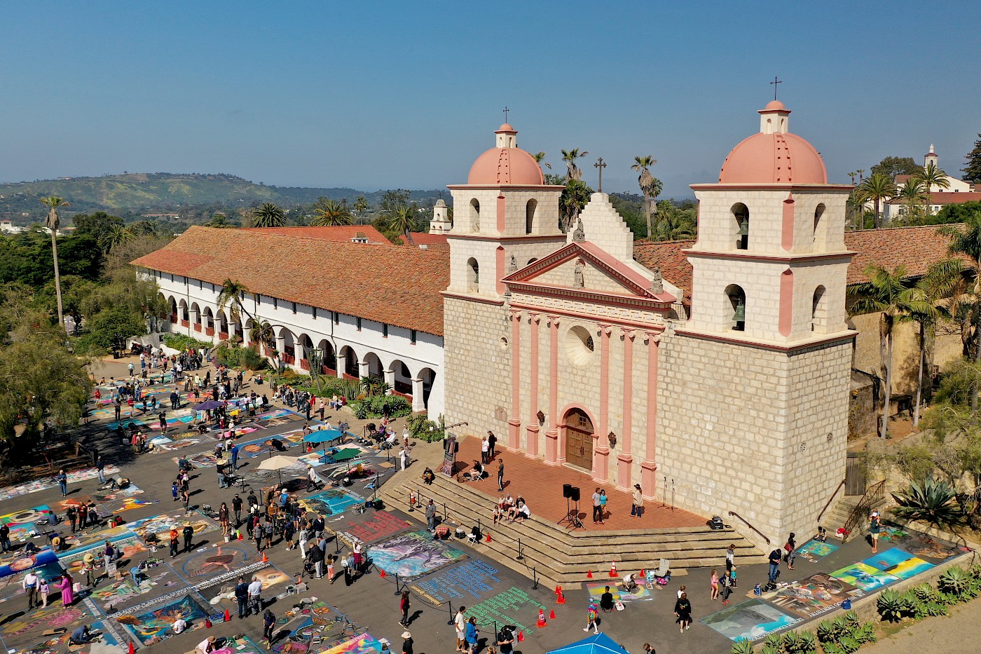 Drone shot of the Santa Barbara Mission including chalk art on the sidewalks