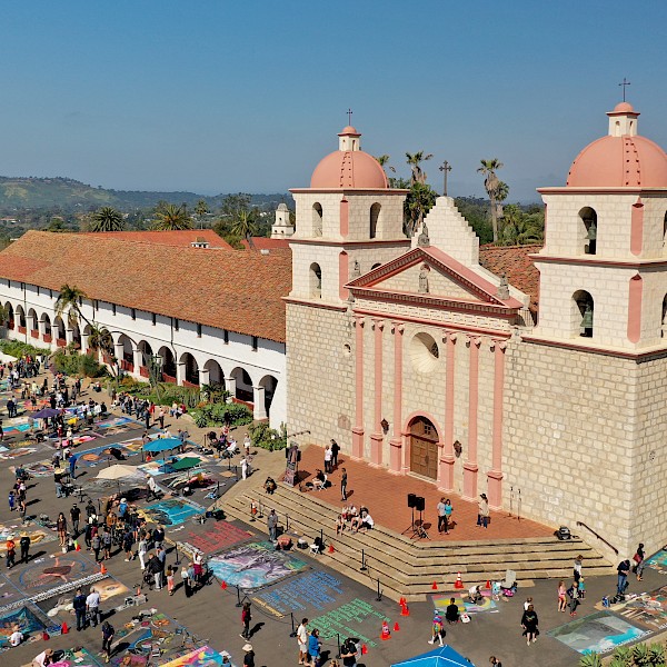Drone shot of the Santa Barbara Mission including chalk art on the sidewalks